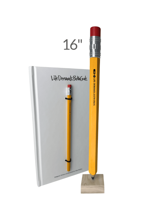 16-inch yellow pencil with a red eraser mounted on a wooden base, standing beside a matching book titled "Life Demands Both Ends.".